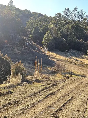 a view of a big house with a mountain in the background