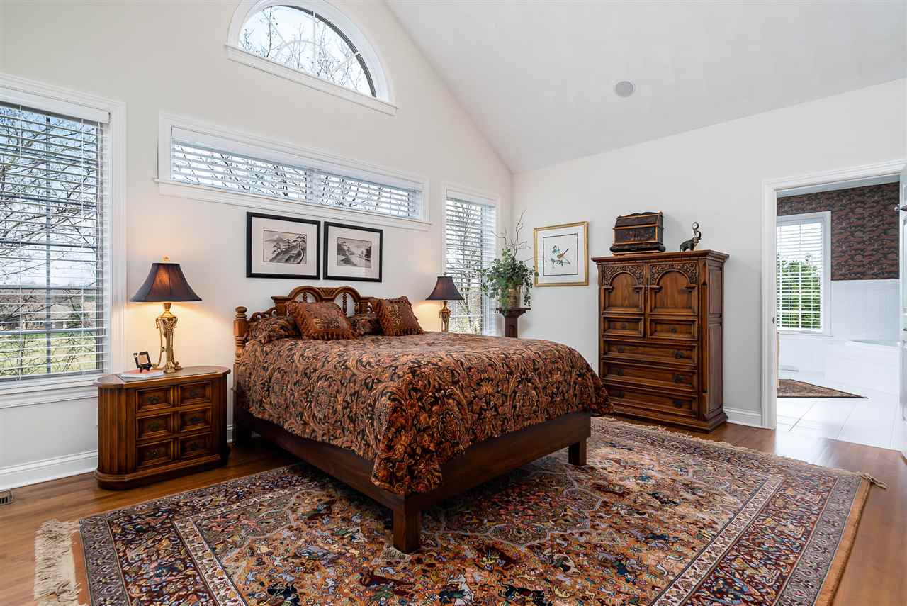 887 Timber Ridge Trail Rockford, IL 61114 - Photo 3 of 6 a bedroom with a bed and wooden floor