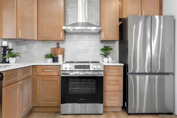 a kitchen with appliances and cabinets