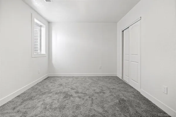 an empty room with a empty space and window
