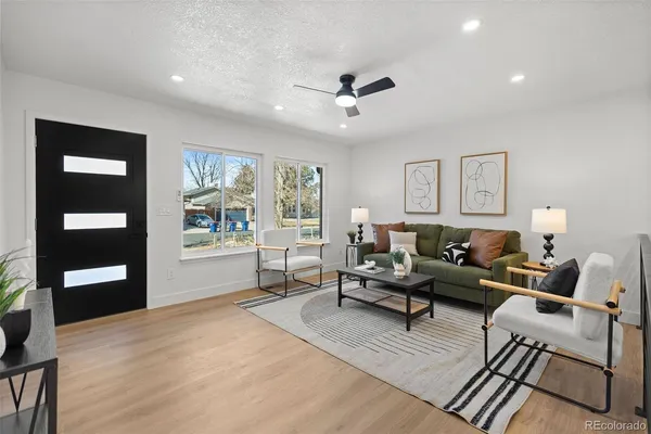 a living room with furniture and window