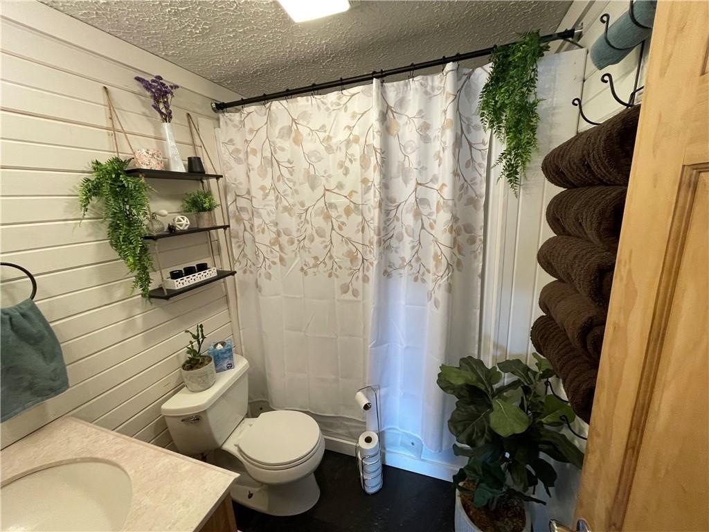 366 Stevenson Road Greenville, PA 16125 - Photo 5 of 14 a bathroom with a toilet and a shower curtain