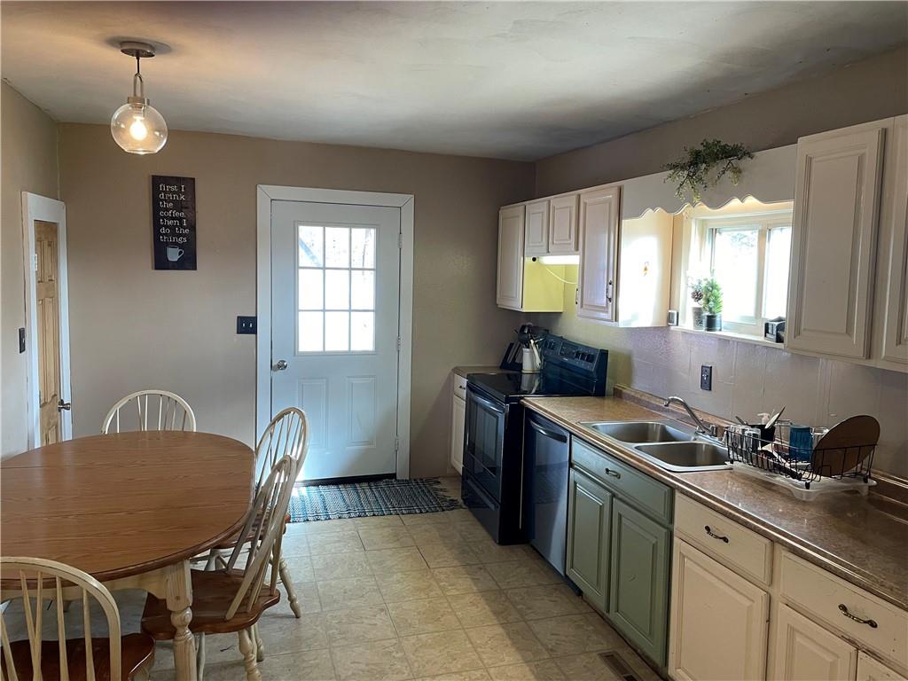 366 Stevenson Road Greenville, PA 16125 - Photo 10 of 14 a kitchen that has a table chairs in it and wooden floors
