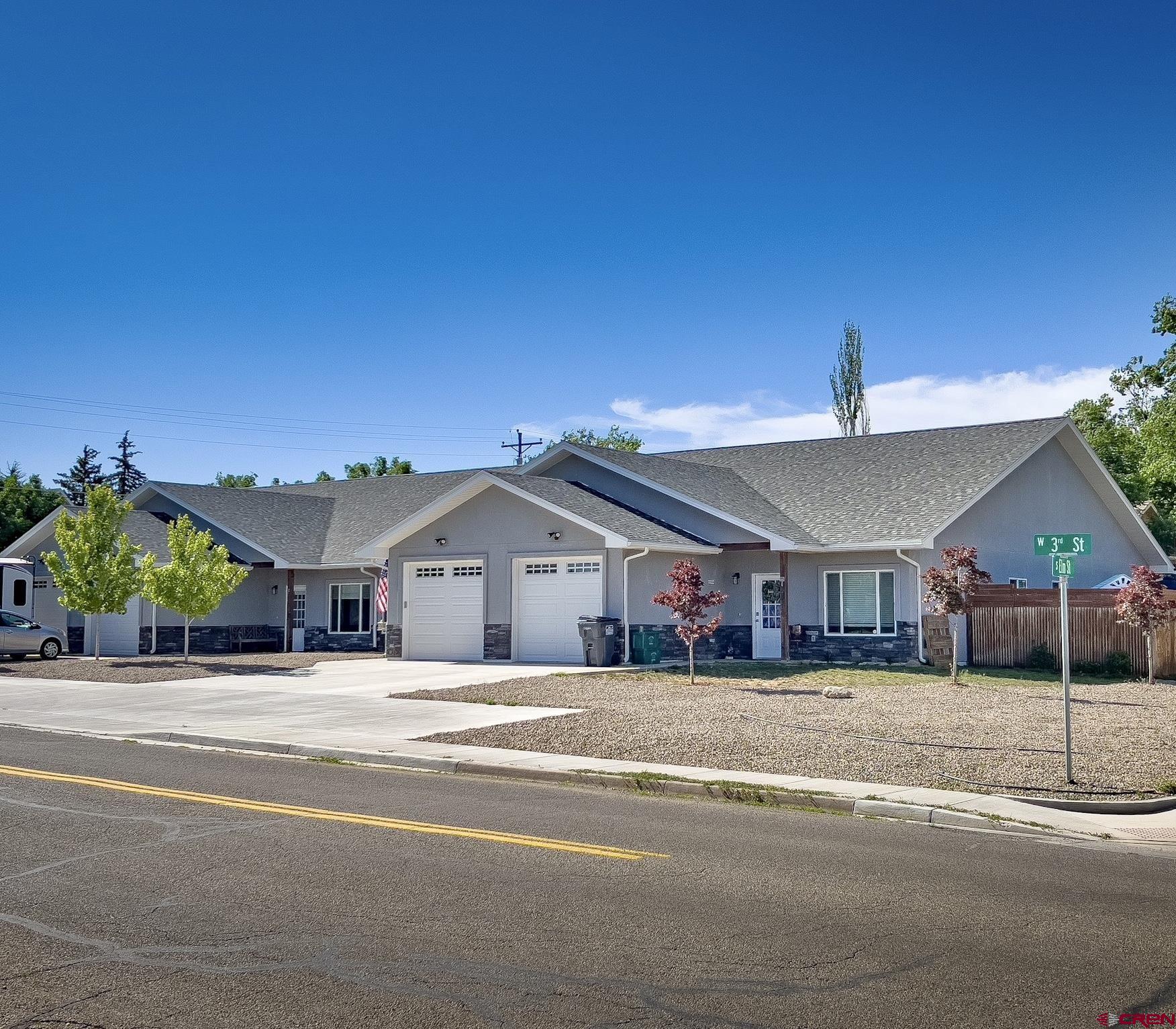 a view of a house next to a road