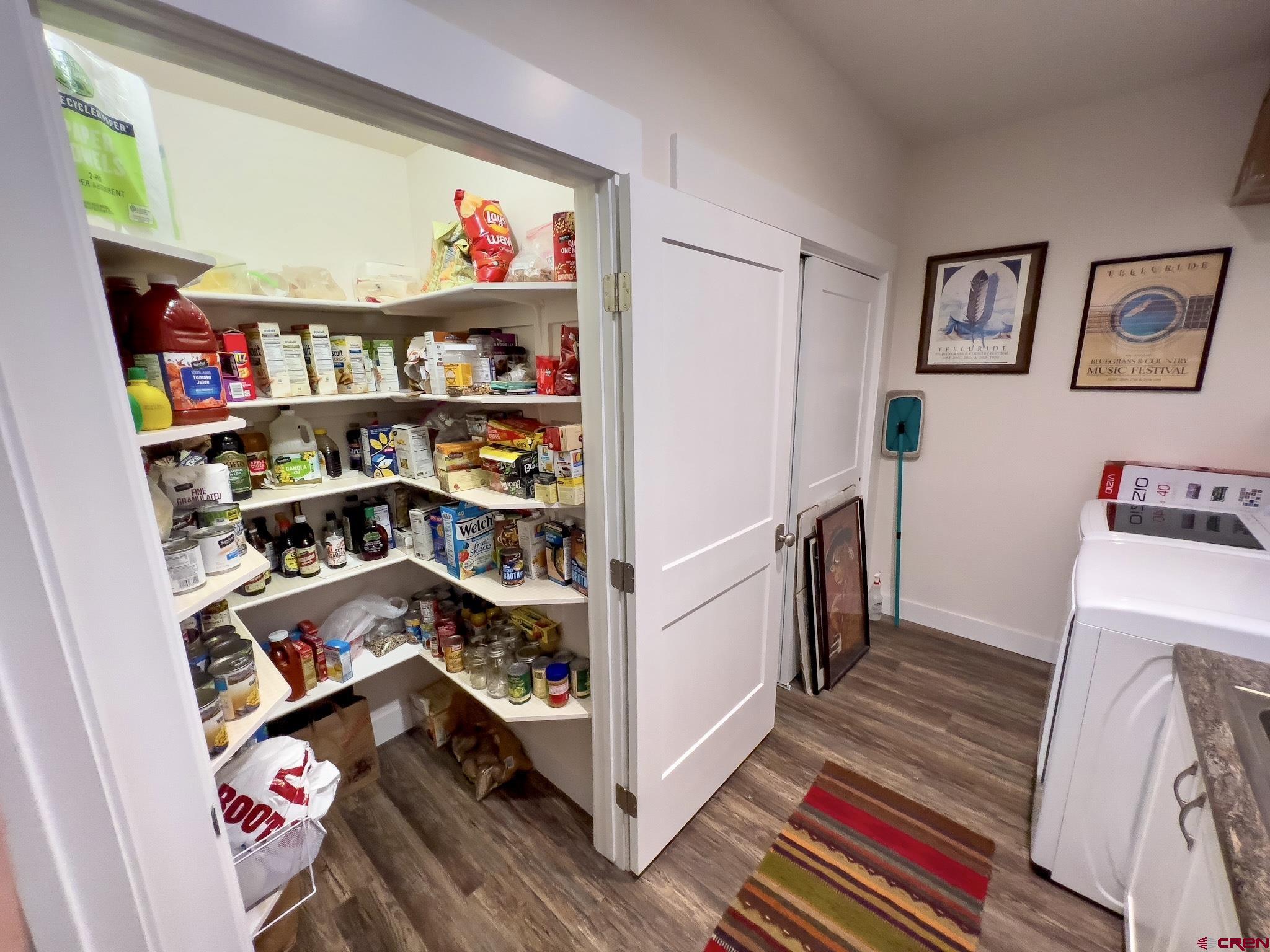 210 West 3rd Street, Unit 2 Cortez, CO 81321 - Photo 13 of 19 a room with furniture and a book shelf