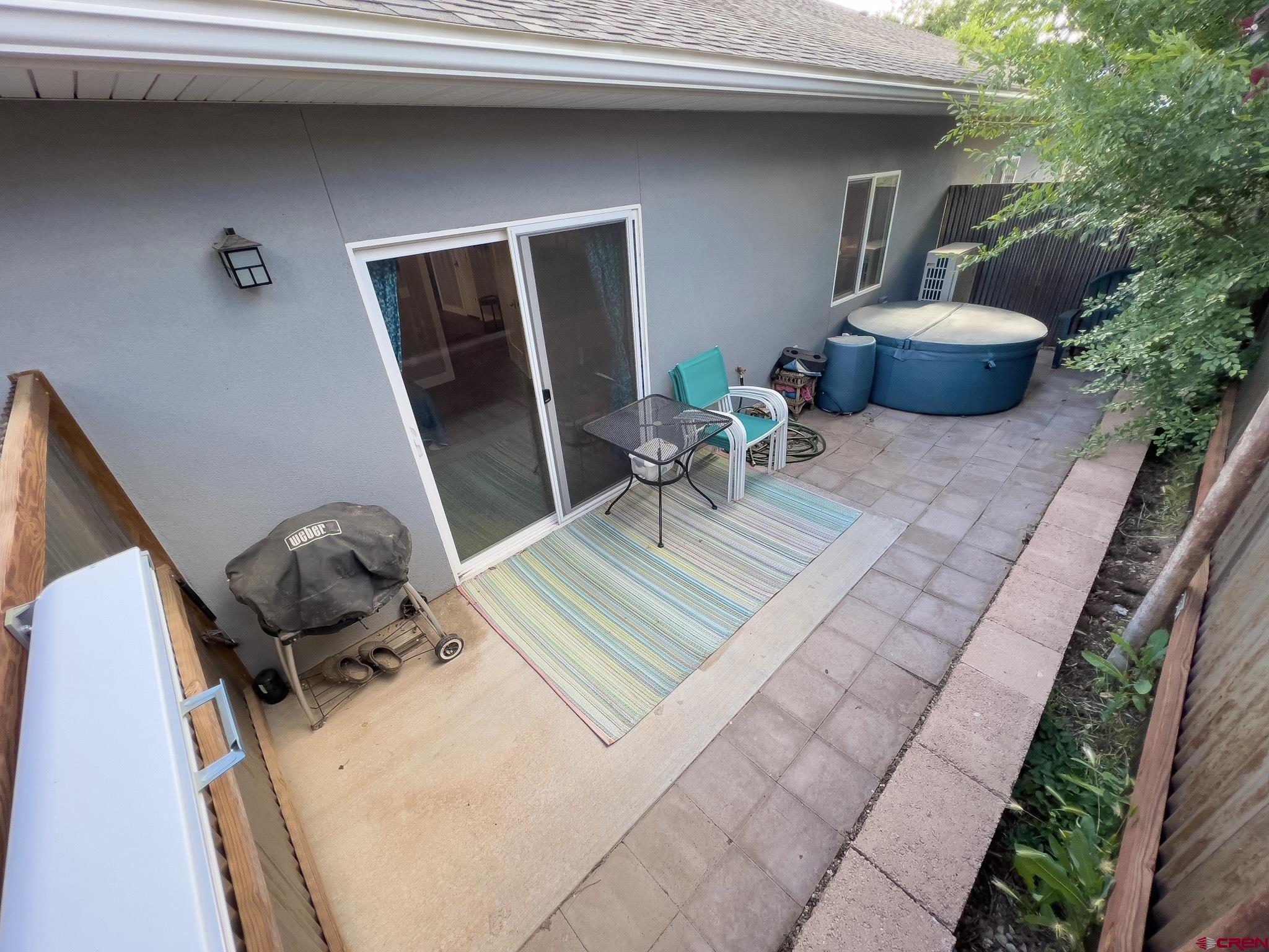 210 West 3rd Street, Unit 2 Cortez, CO 81321 - Photo 15 of 19 a front view of a house with patio