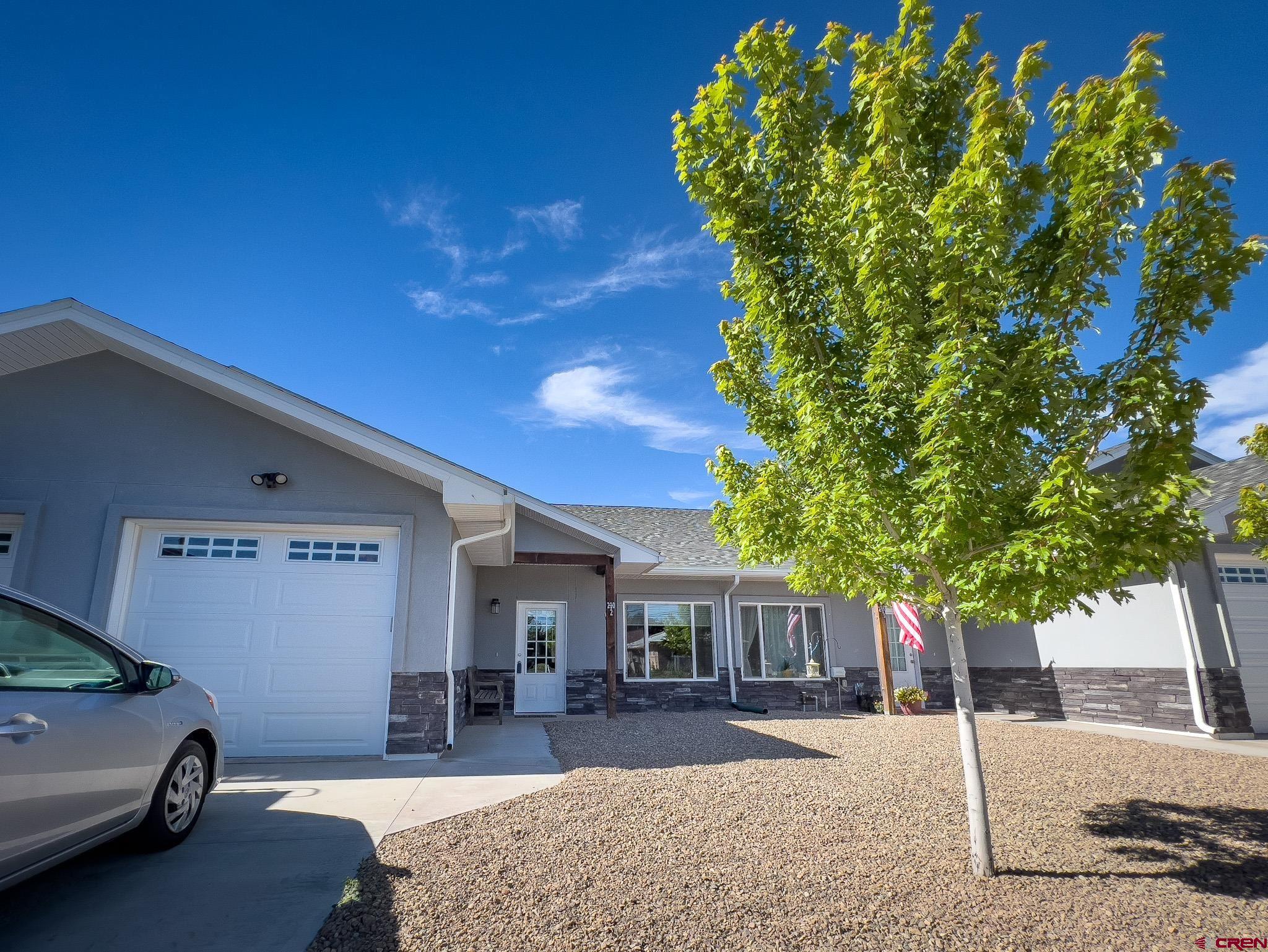 210 West 3rd Street, Unit 2 Cortez, CO 81321 - Photo 18 of 19 a house view with a backyard space
