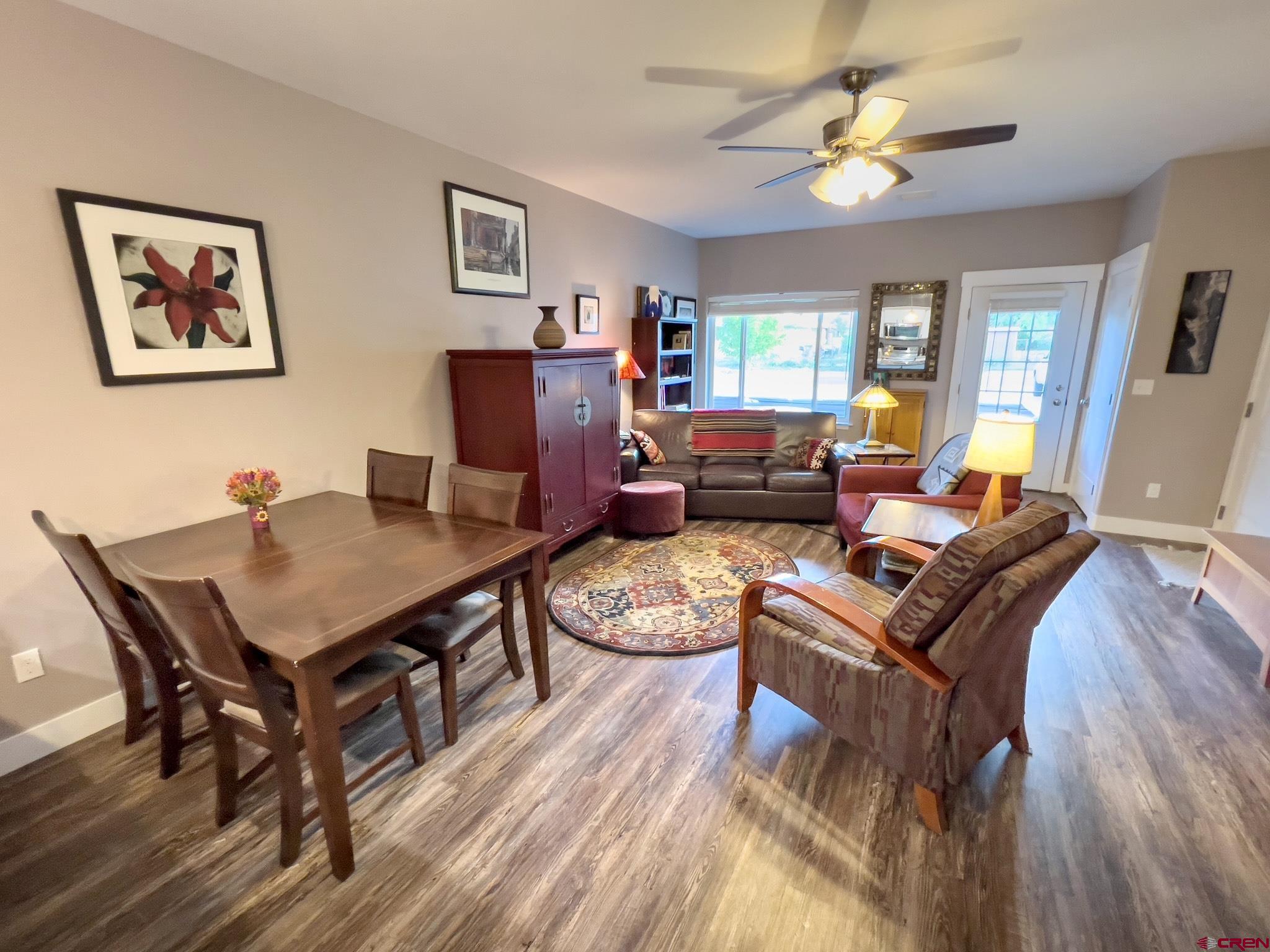 210 West 3rd Street, Unit 2 Cortez, CO 81321 - Photo 4 of 19 a living room with furniture and a wooden floor