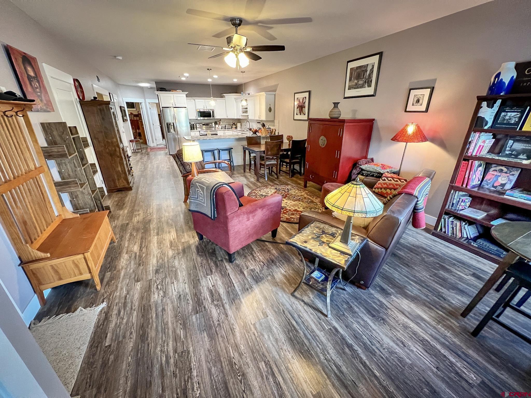 210 West 3rd Street, Unit 2 Cortez, CO 81321 - Photo 5 of 19 a living room with furniture and a wooden floor