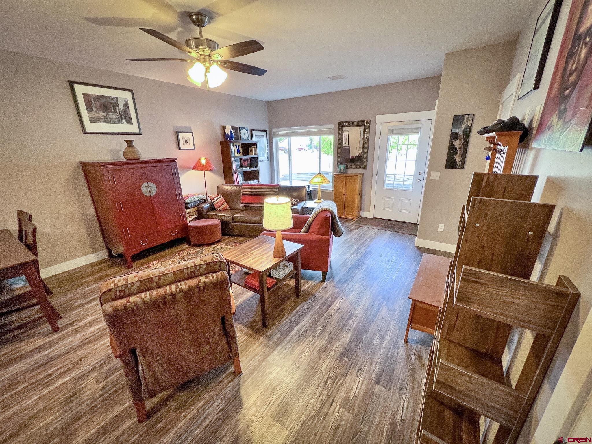 210 West 3rd Street, Unit 2 Cortez, CO 81321 - Photo 6 of 19 a living room with furniture and a wooden floor