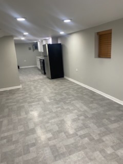 6827 South Green Street Chicago, IL 60621 - Photo 15 of 24 a view of a livingroom with a refrigerator