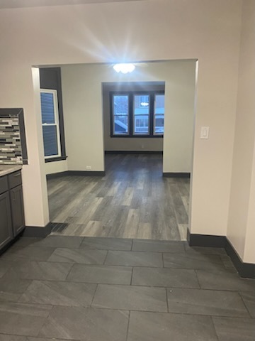 6827 South Green Street Chicago, IL 60621 - Photo 17 of 24 an empty room with windows