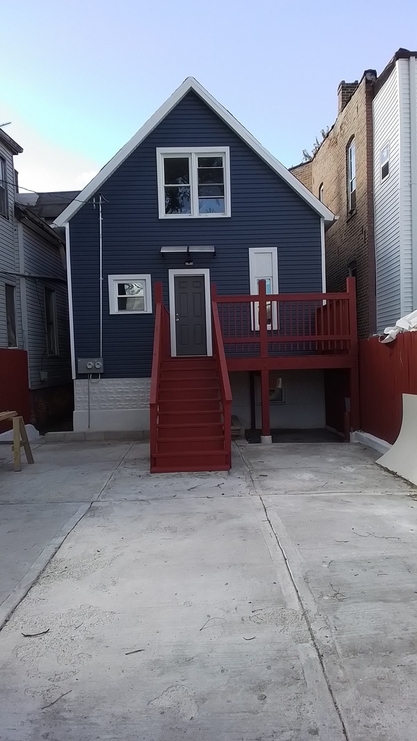 6827 South Green Street Chicago, IL 60621 - Photo 3 of 24 a front view of a house with balcony