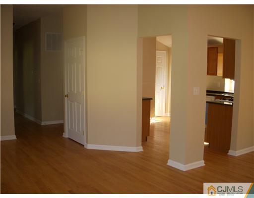 61 Major Road Monmouth Junction, NJ 08852 - Photo 5 of 12 a view of a hallway with wooden floor