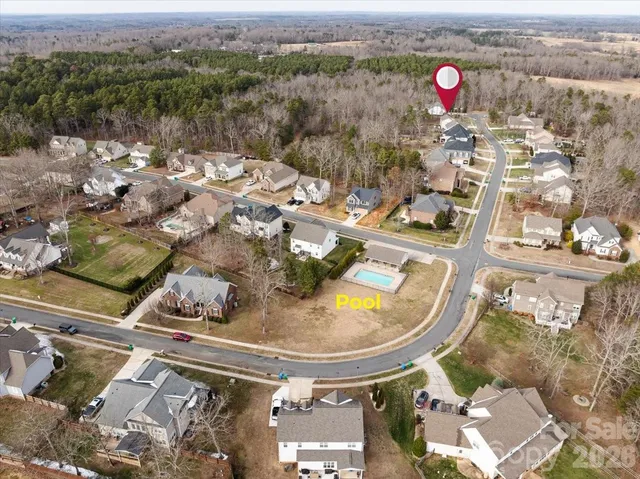 an aerial view of a swimming pool and mountain view