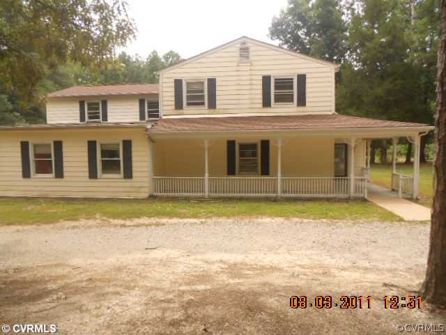 a front view of a house with a swimming pool