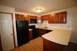 a kitchen with stainless steel appliances a refrigerator and a sink