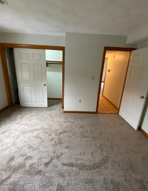 132 Tyngsboro Road, Unit 1 North Chelmsford, MA 01863 - Photo 7 of 16 an empty room with closet
