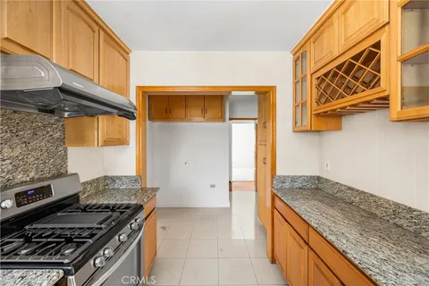 a kitchen with a stove and a microwave