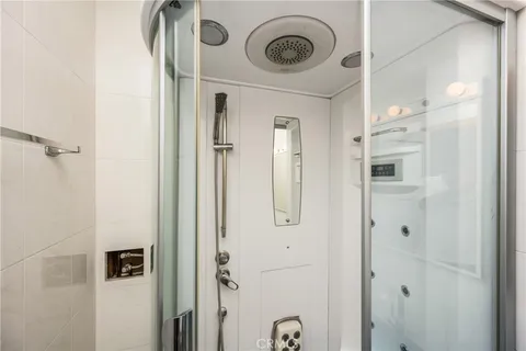 a view of a hallway with washer and dryer