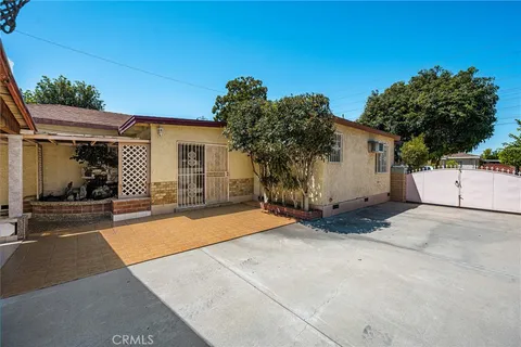 a house with tree in front of it