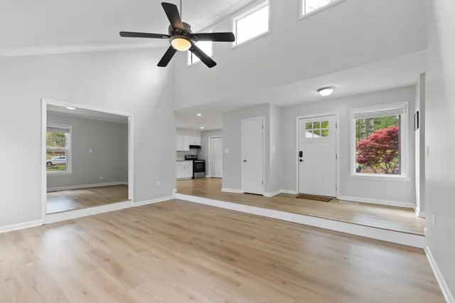 wooden floor in an empty room with a window