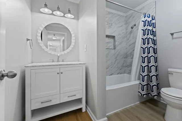 a bathroom with a toilet a sink and a bathtub