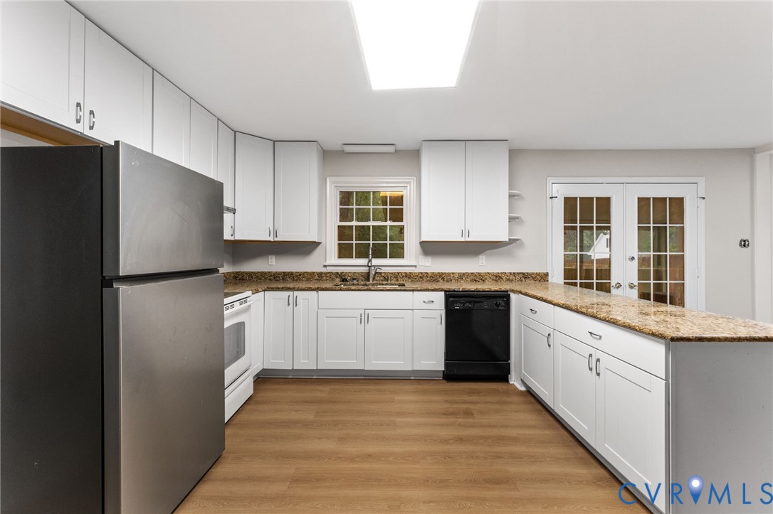 3151 Mountclair Road Chester, VA 23831 - Photo 14 of 36 Kitchen featuring extensive white cabinetry, light