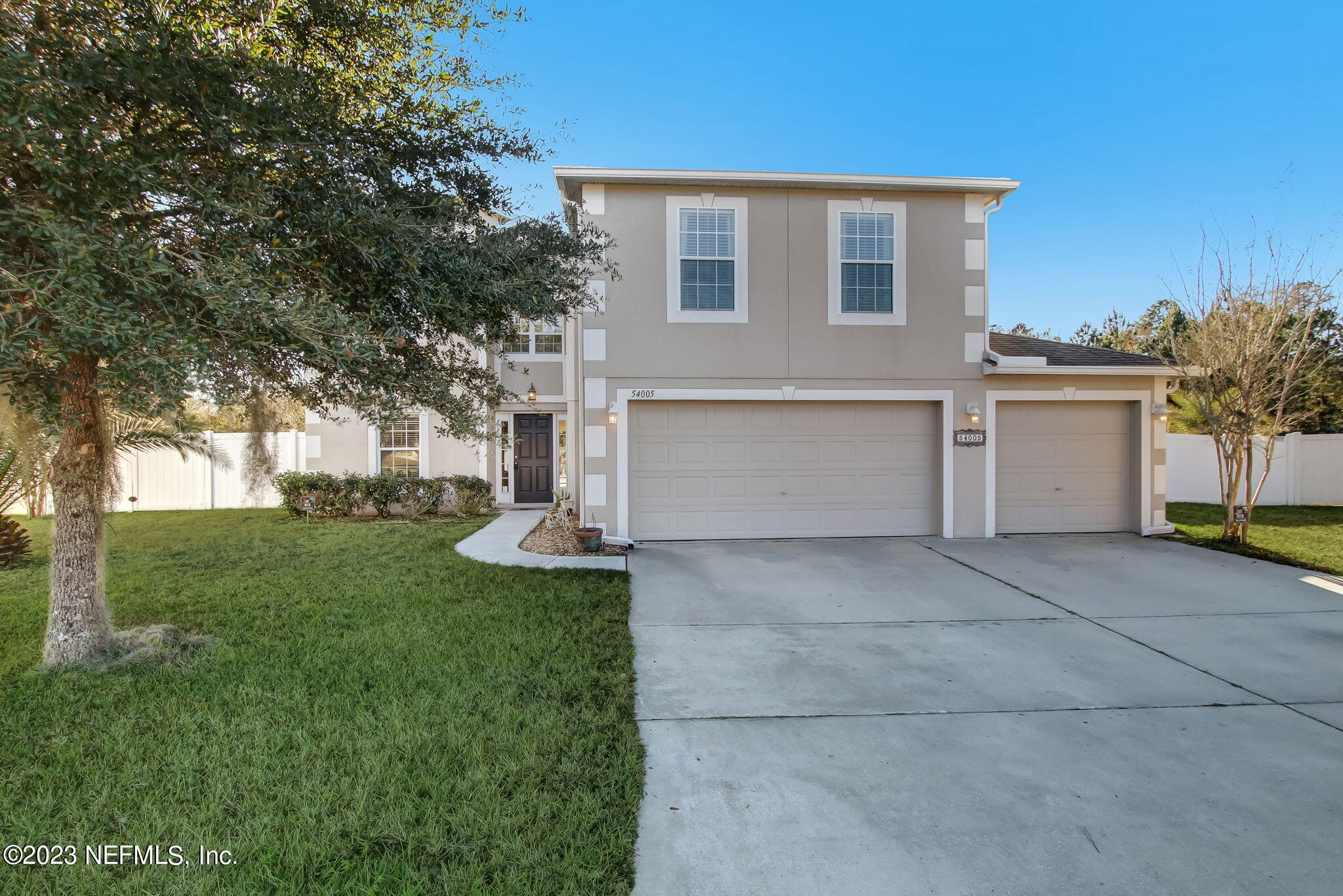 54005 Turning Leaf Drive Callahan, FL 32011 - Photo 1 of 54 a front view of house with yard and tree