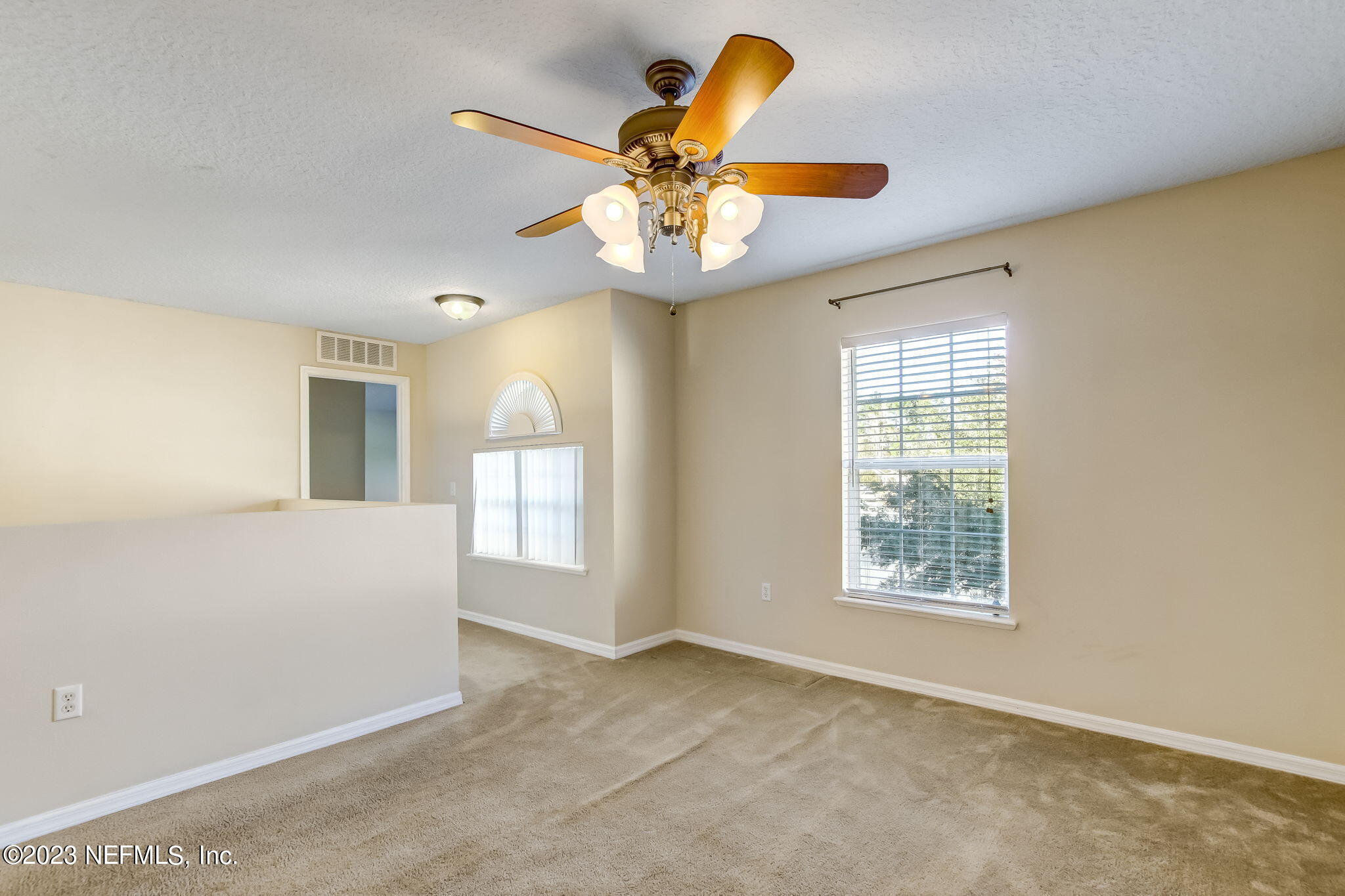 54005 Turning Leaf Drive Callahan, FL 32011 - Photo 21 of 54 an empty room with a window and ceiling fan