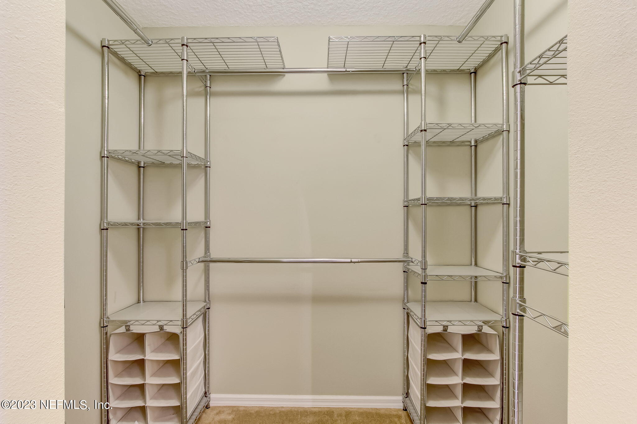 54005 Turning Leaf Drive Callahan, FL 32011 - Photo 30 of 54 a view of walk in closet with empty racks