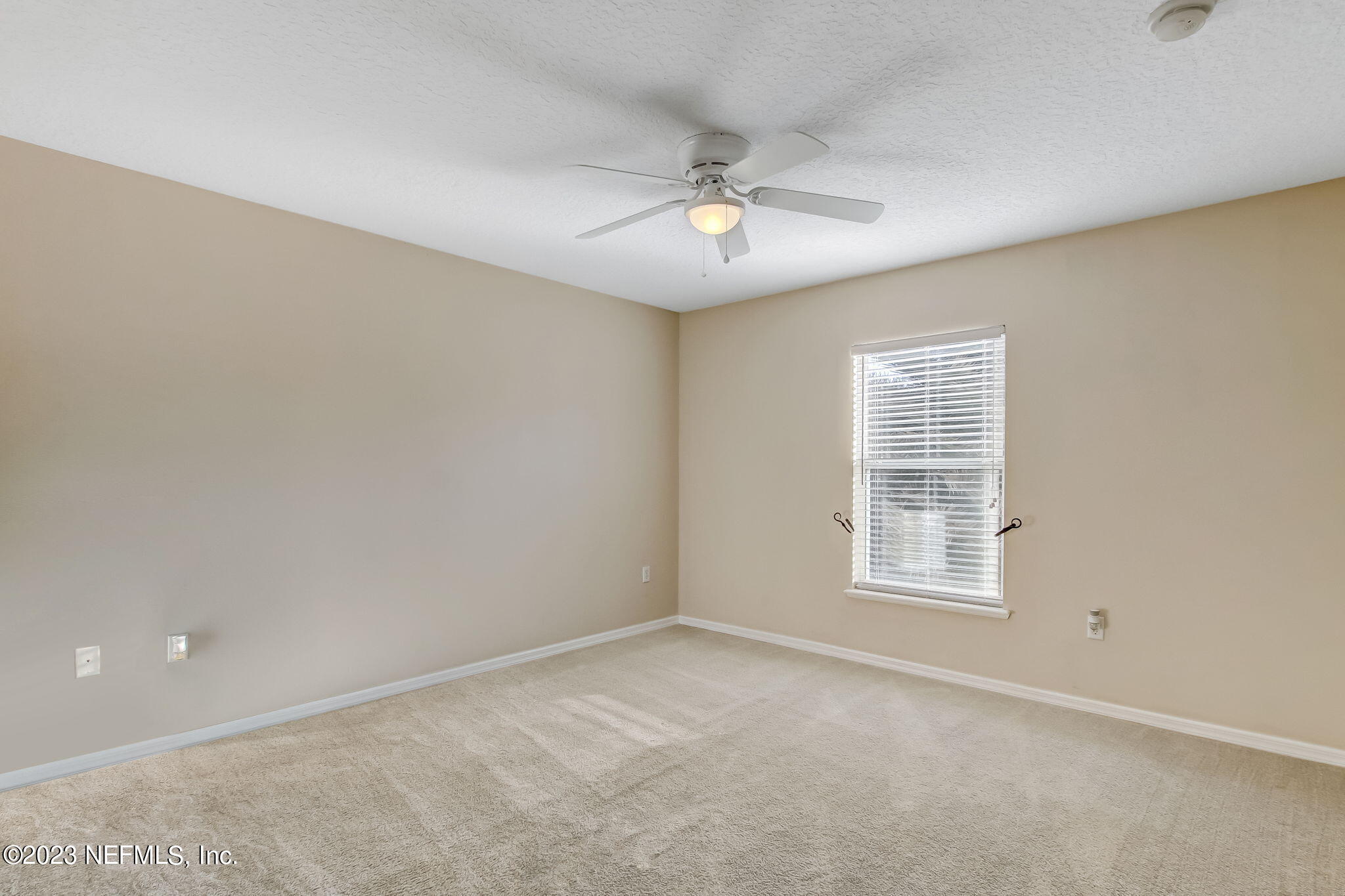 54005 Turning Leaf Drive Callahan, FL 32011 - Photo 31 of 54 an empty room with windows and fan
