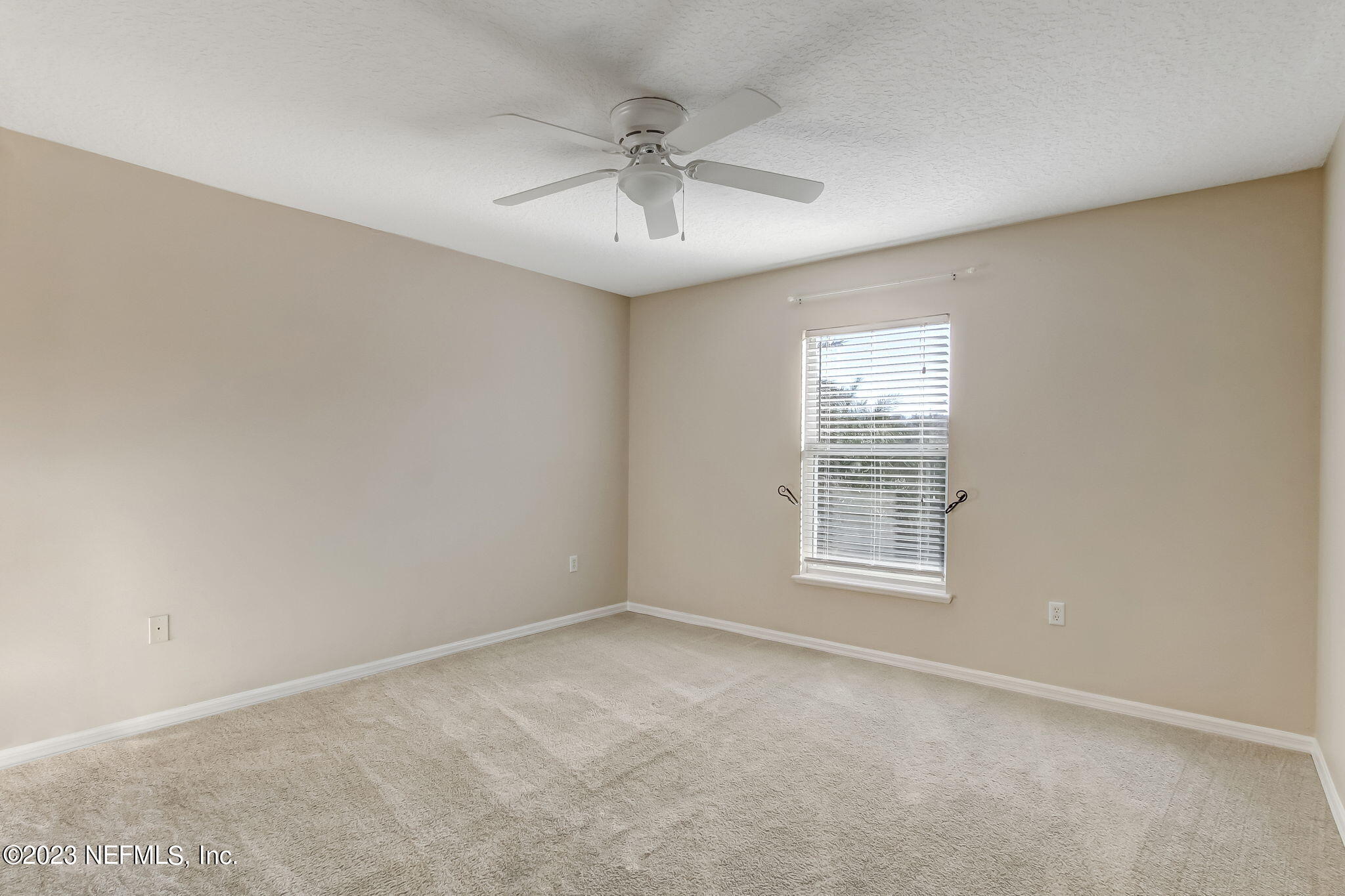 54005 Turning Leaf Drive Callahan, FL 32011 - Photo 33 of 54 an empty room with a window and a ceiling fan