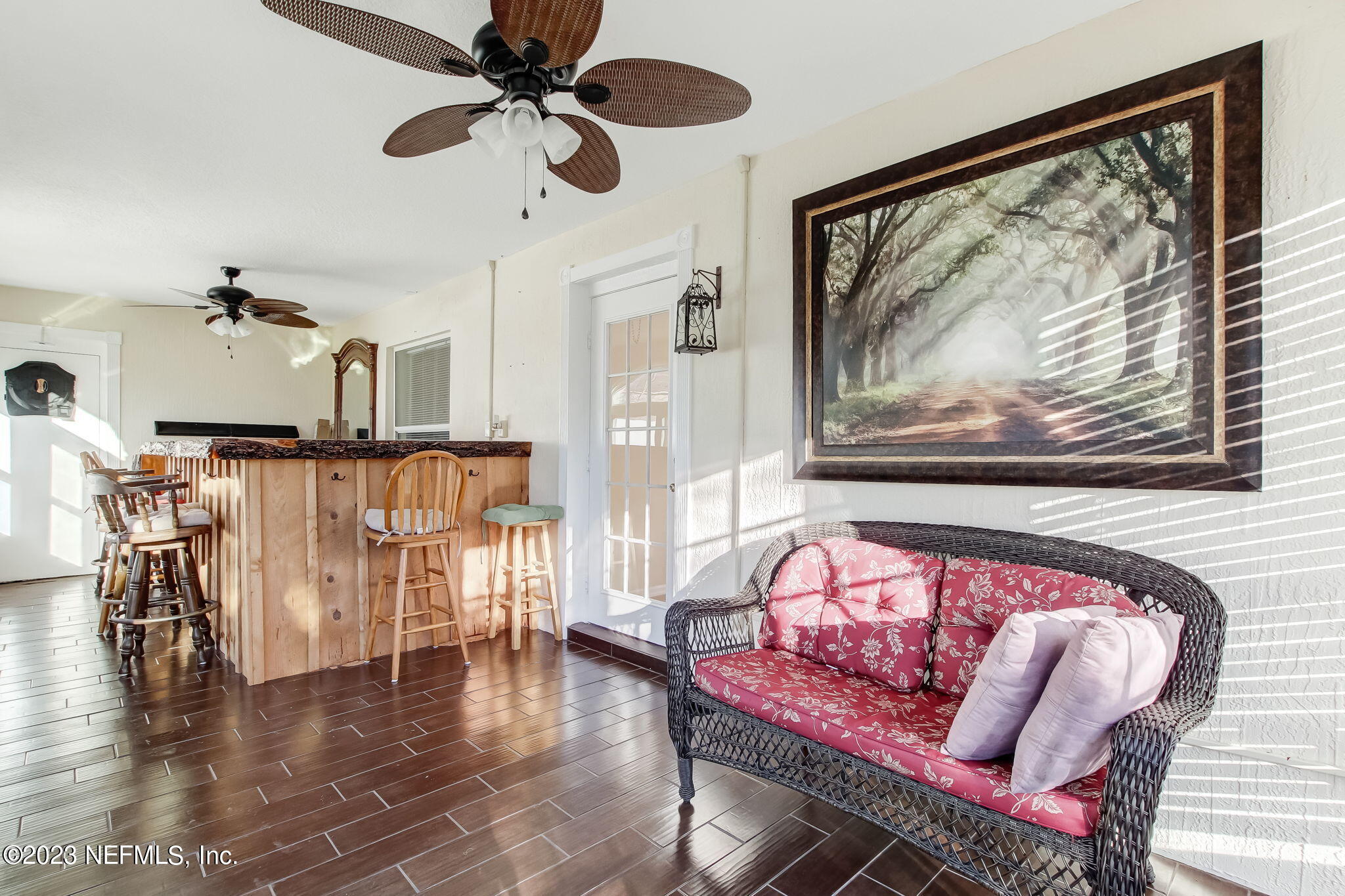 54005 Turning Leaf Drive Callahan, FL 32011 - Photo 39 of 54 a view of a dining room with furniture window and wooden floor