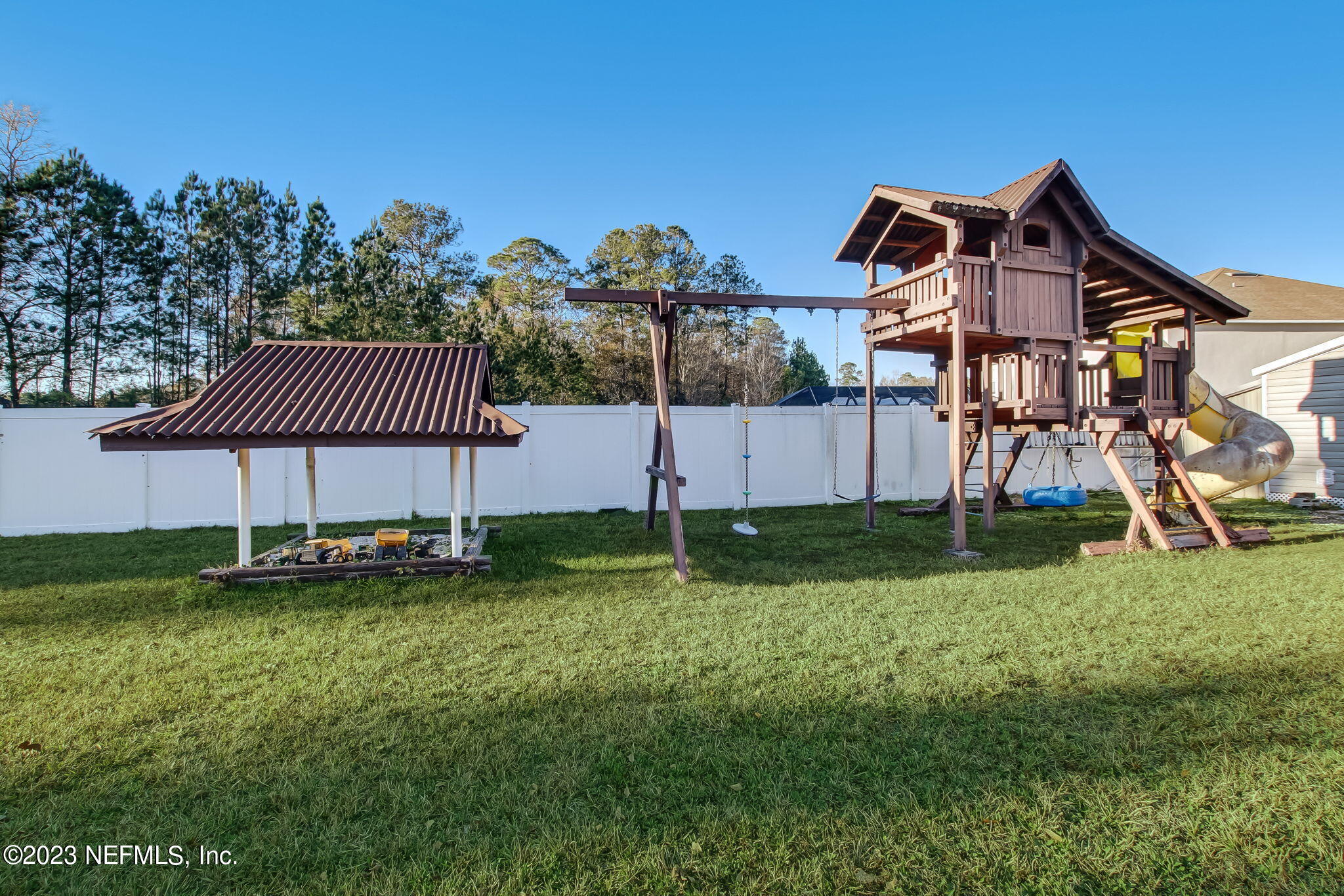 54005 Turning Leaf Drive Callahan, FL 32011 - Photo 43 of 54 a view of a house with a backyard