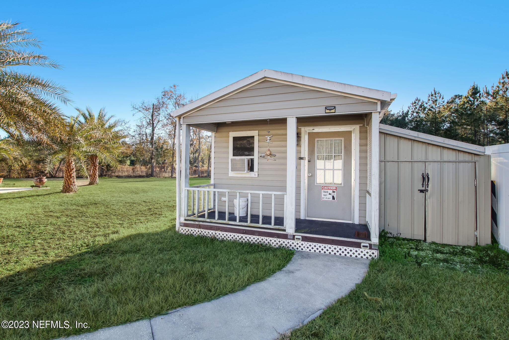 54005 Turning Leaf Drive Callahan, FL 32011 - Photo 44 of 54 a view of a house with a small yard and a garden