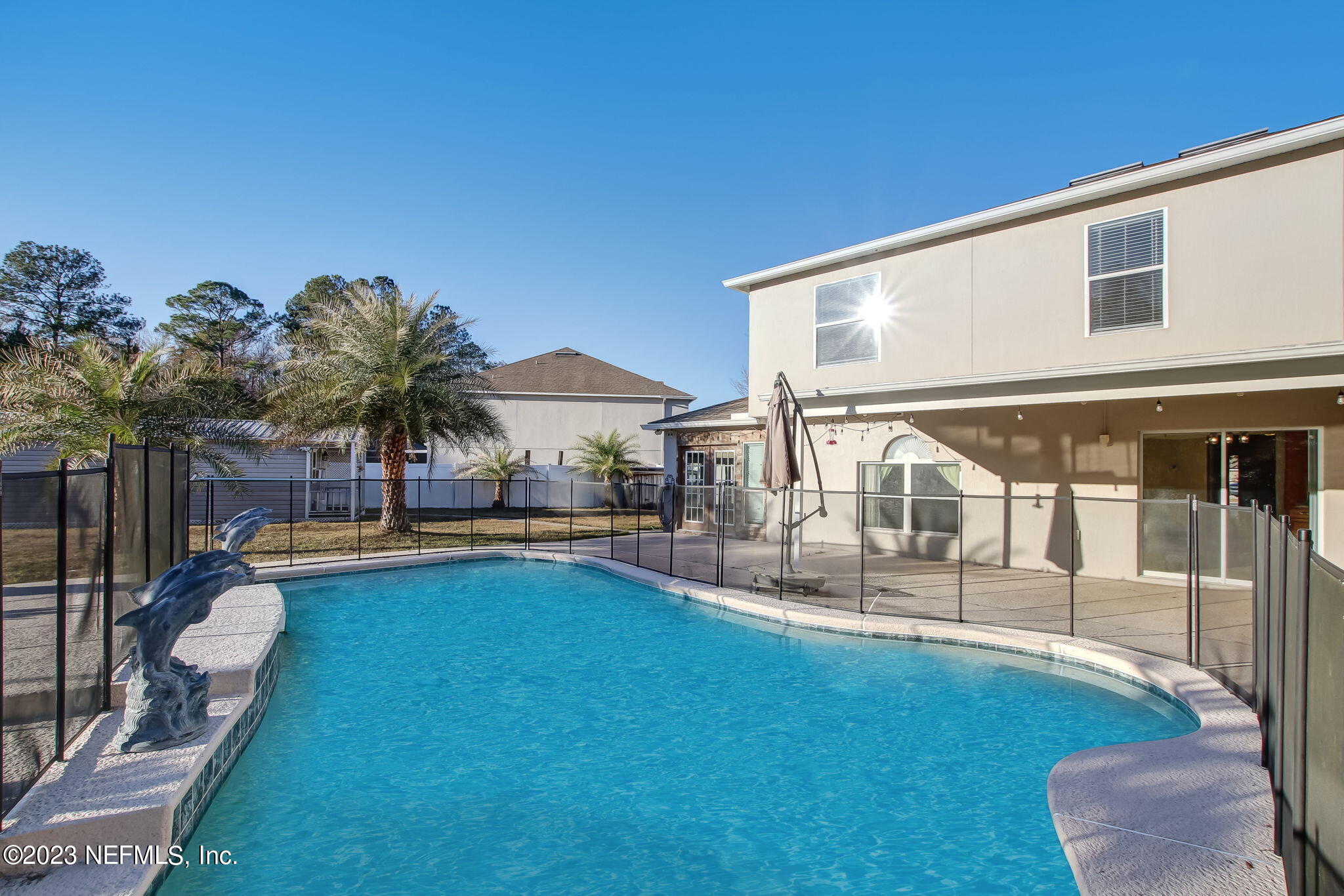 54005 Turning Leaf Drive Callahan, FL 32011 - Photo 46 of 54 a view of a house with backyard and sitting area
