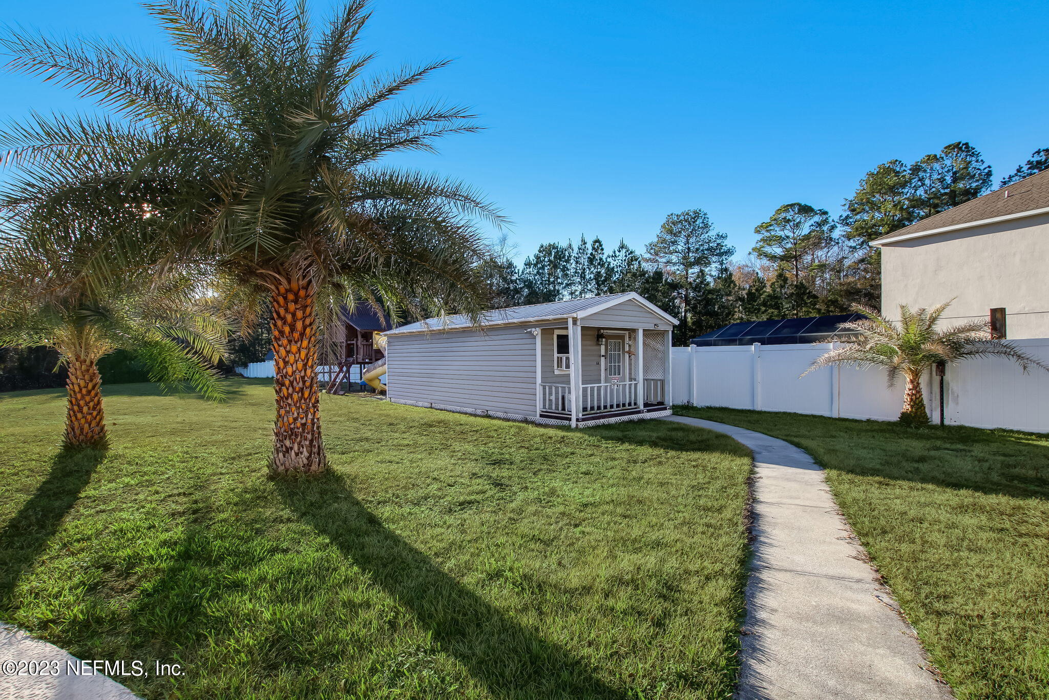 54005 Turning Leaf Drive Callahan, FL 32011 - Photo 50 of 54 a backyard of a house with lots of green space