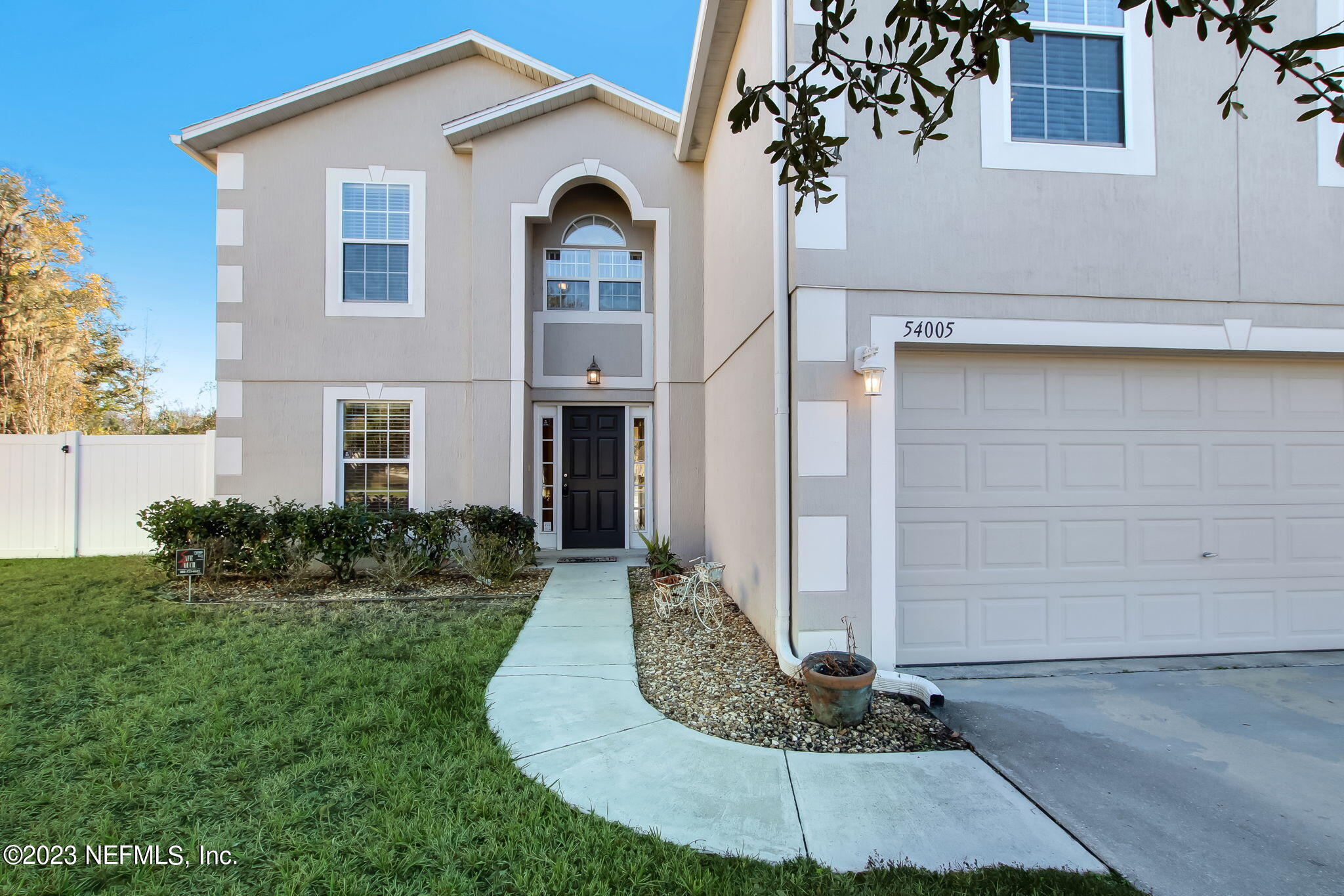 54005 Turning Leaf Drive Callahan, FL 32011 - Photo 5 of 54 a front view of a house with garden