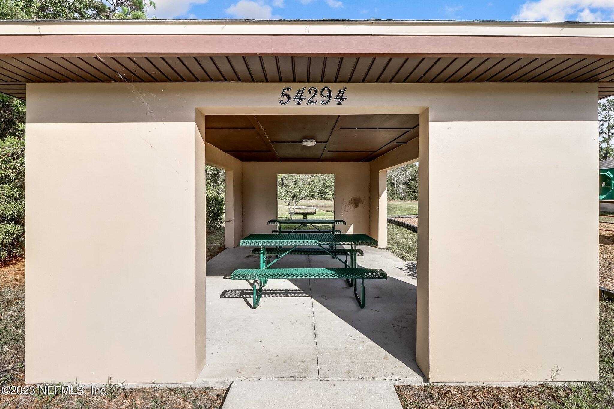 54005 Turning Leaf Drive Callahan, FL 32011 - Photo 53 of 54 a living room with furniture and a potted plant