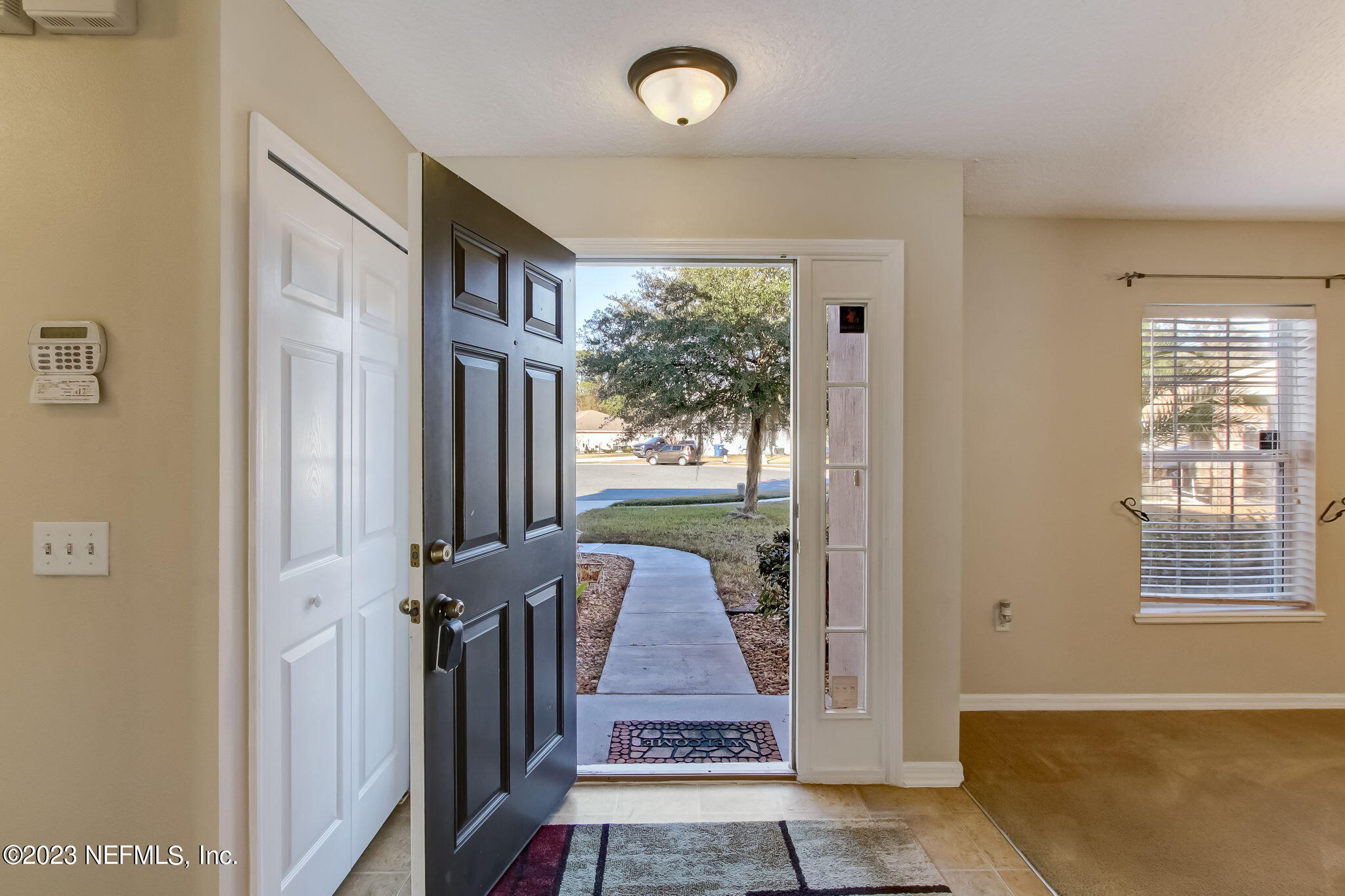 54005 Turning Leaf Drive Callahan, FL 32011 - Photo 6 of 54 a view of a hallway with windows