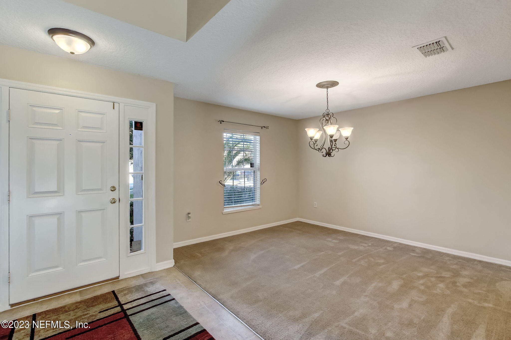 54005 Turning Leaf Drive Callahan, FL 32011 - Photo 7 of 54 wooden floor in an empty room with a window
