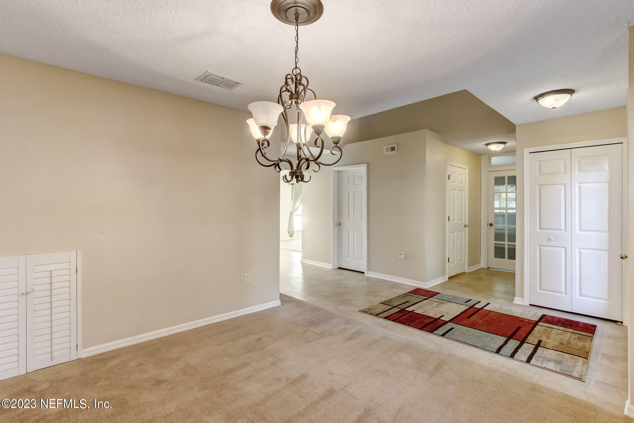 54005 Turning Leaf Drive Callahan, FL 32011 - Photo 8 of 54 a very nice looking room with a chandelier
