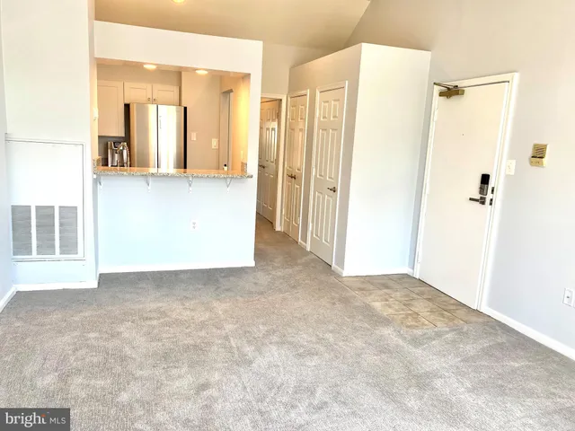 a view of a big room with cabinet and mirrors