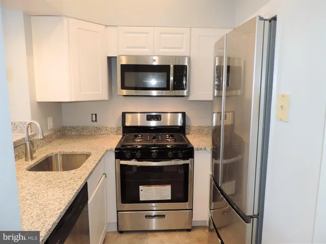 a kitchen with a stove and a microwave