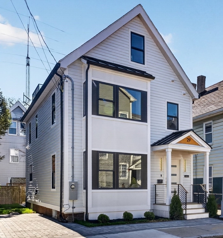 a front view of a house with yard