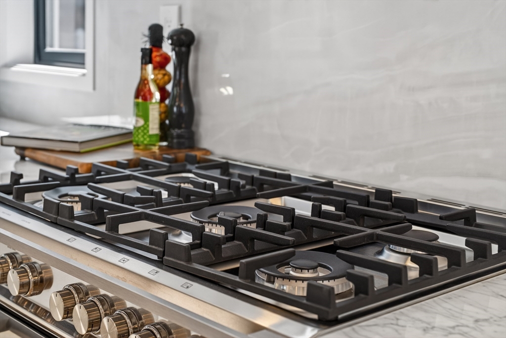 29 Line Street Cambridge, MA 02138 - Photo 13 of 42 a close up of a stove top oven sitting on a floor