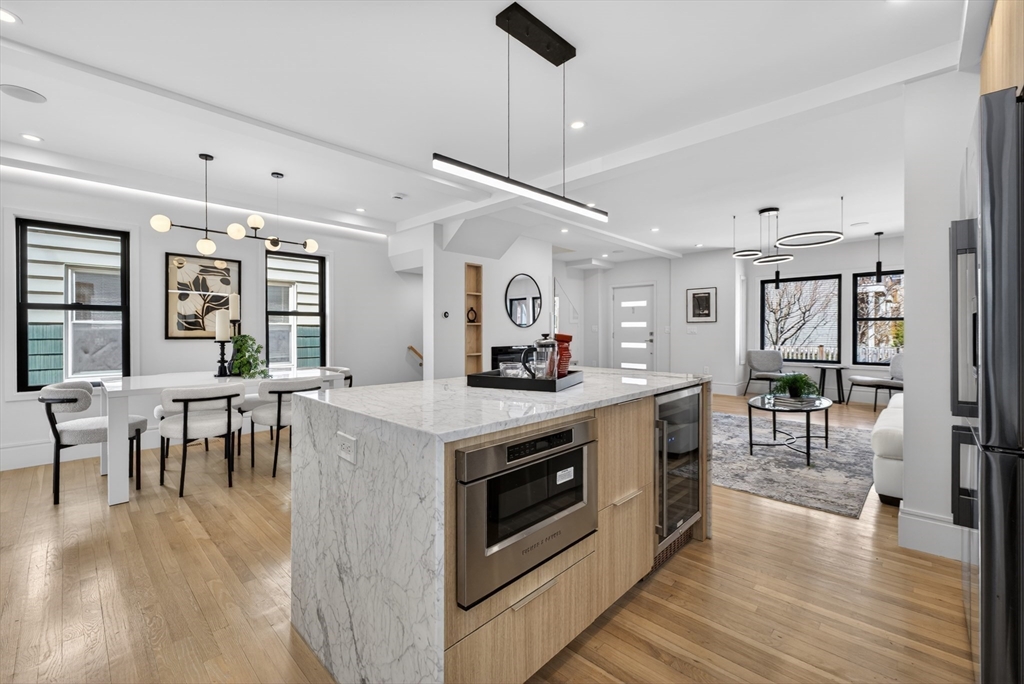29 Line Street Cambridge, MA 02138 - Photo 14 of 42 a kitchen with stove and wooden floor