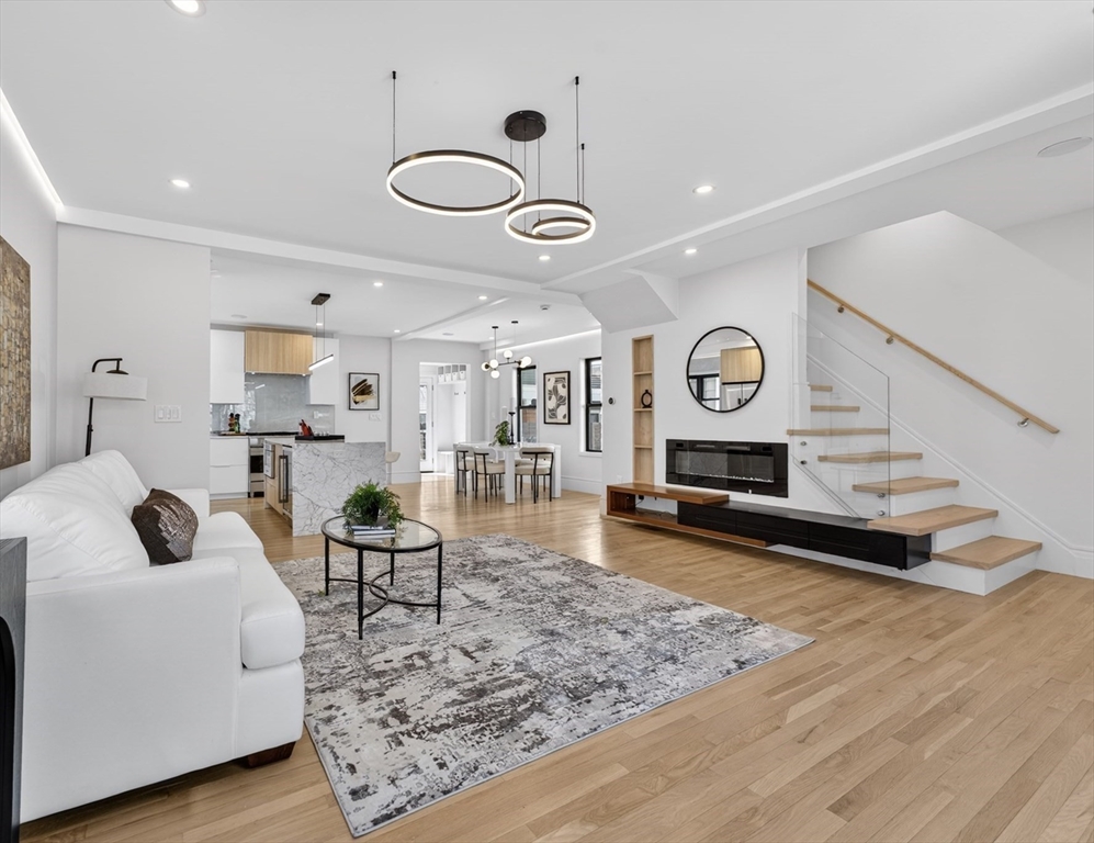 29 Line Street Cambridge, MA 02138 - Photo 15 of 42 a living room with furniture and a wooden floor