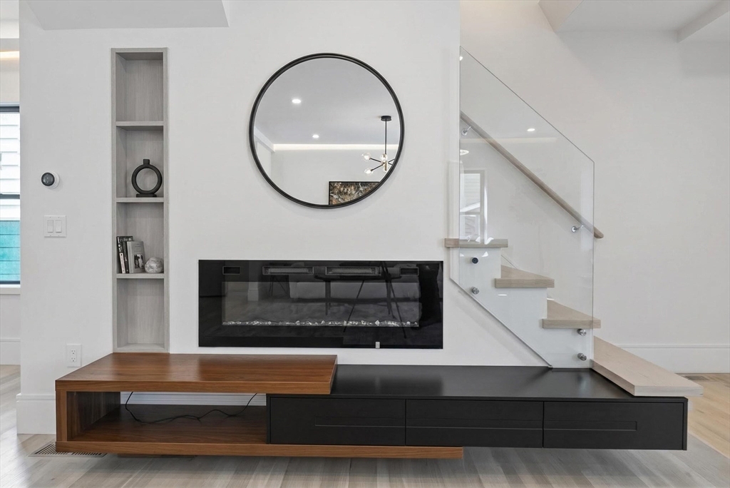 29 Line Street Cambridge, MA 02138 - Photo 16 of 42 a living room with furniture and a mirror